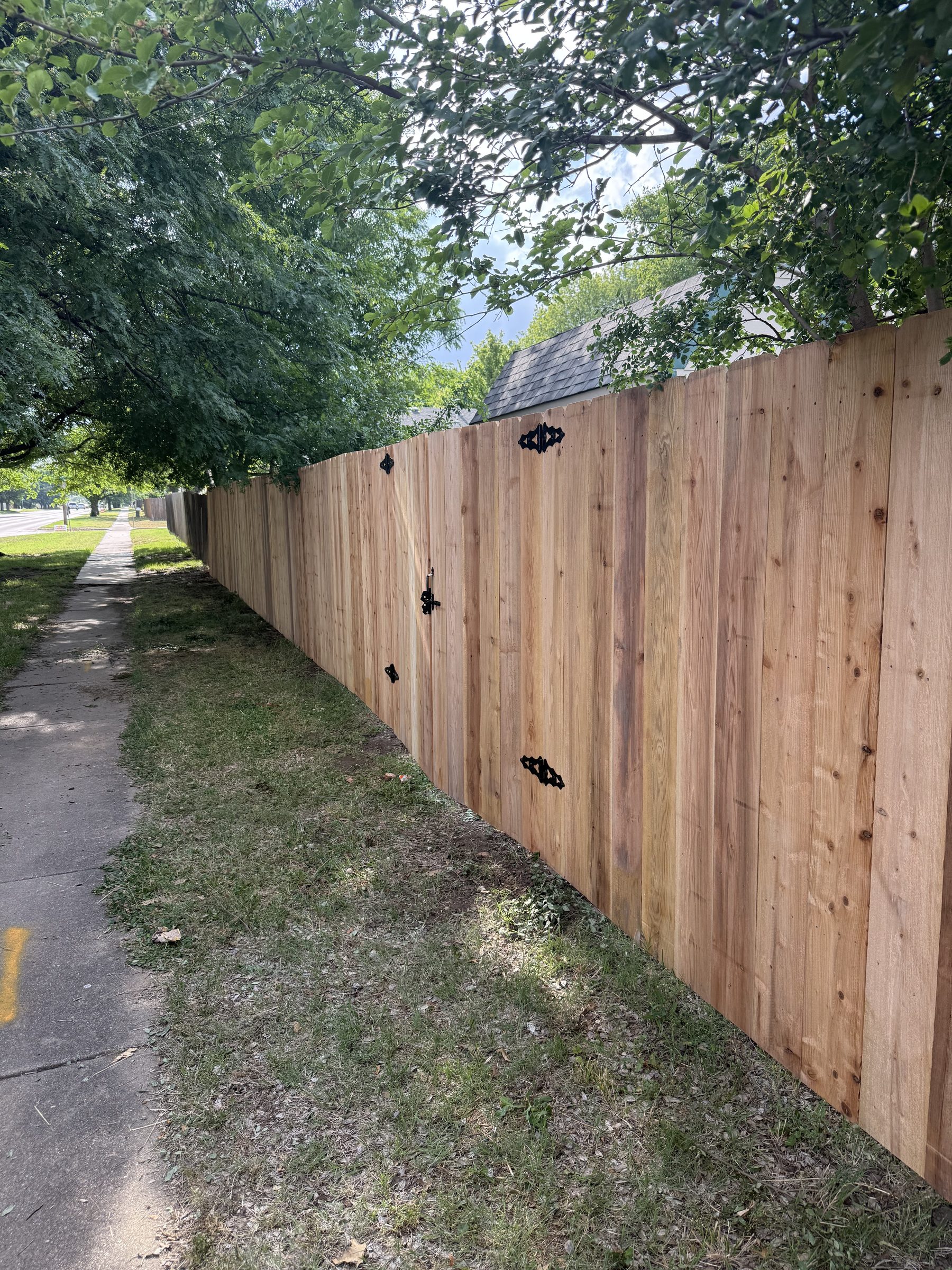 Cedar fence with gate on corner lot