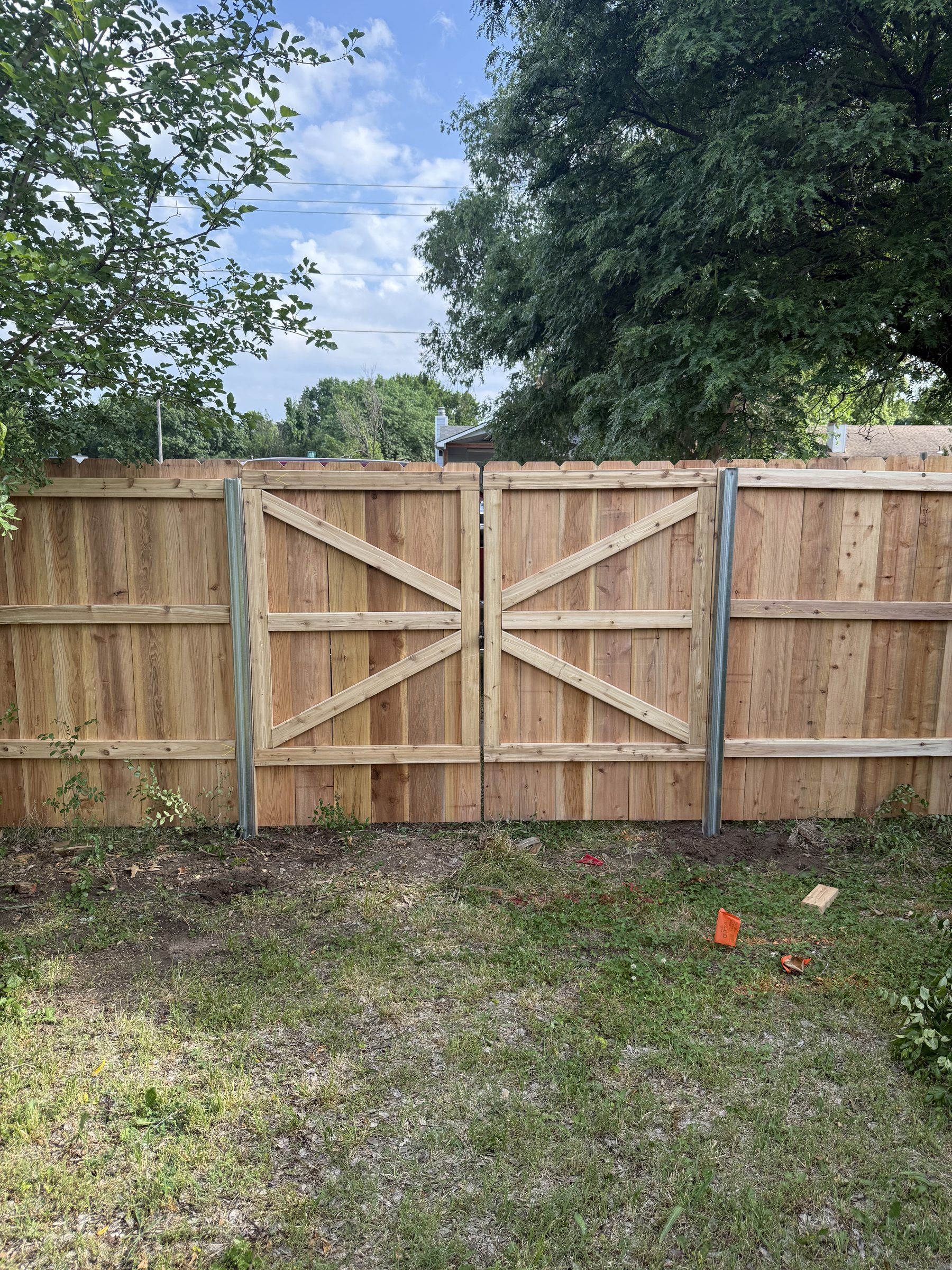 Wood fence and gate installation complete